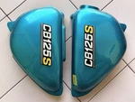 Honda 1975 CB125S Side Cover & Emblem Set Pair New Not Genuine Has Defect. Fixed Price $180.00.