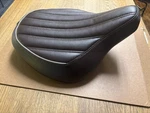 Triumph Bobber Rider Brown Ribbed Seat - A9700425. Fixed Price $186.95.