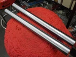 Pan/shovel "new" 1949-76 Pair Of Stock Length Polished Fork Tubes #45950-48. Fixed Price $120.00.