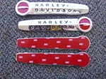 Nos 1947-1950 Harley Davidson Eagle Iron Gas Tank Emblems With Mounting Bracket. Fixed Price $129.95.