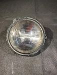1982 Kawasaki 250-A Headlight Assembly 23007-4002. Fixed Price $19.95.