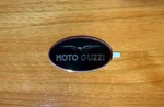 Moto Guzzi Fuel Tank Emblem Left Side 83MM X 45MM - Part# 329173100 Nos. Fixed Price $24.80.