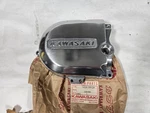 Nos Kawasaki Left Engine Cover, 1974-75 KS125, 1975-1979 KD125, 1976-79 KE125. Fixed Price $59.99.