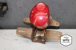 1973 Hodaka Combat Wombat 125 Rear Back Tail Light Mount Bracket E4-4250.UJ. Fixed Price $90.00.