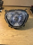 06-24 Suzuki M109 Oem Head Light Assembly #35100-48G30-999 Damaged Eyelet. Fixed Price $122.50.