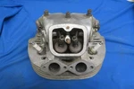 Norton Commando 750 Cylinder Head, W/ Valves, Exhaust Threads Good. Fixed Price $150.00.