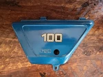 Oem Suzuki 1978 TS100 Left Frame Oil Tank Side Cover 47211-48000. Fixed Price $30.00.