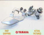 2003 - 2005 Yamaha Front Right Foot Peg Mount Bracket Oem. Fixed Price $44.95.