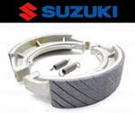 Set Of (2) Suzuki Water Grooved Rear Brake Shoes And Springs #64400-31830. Fixed Price $53.99.